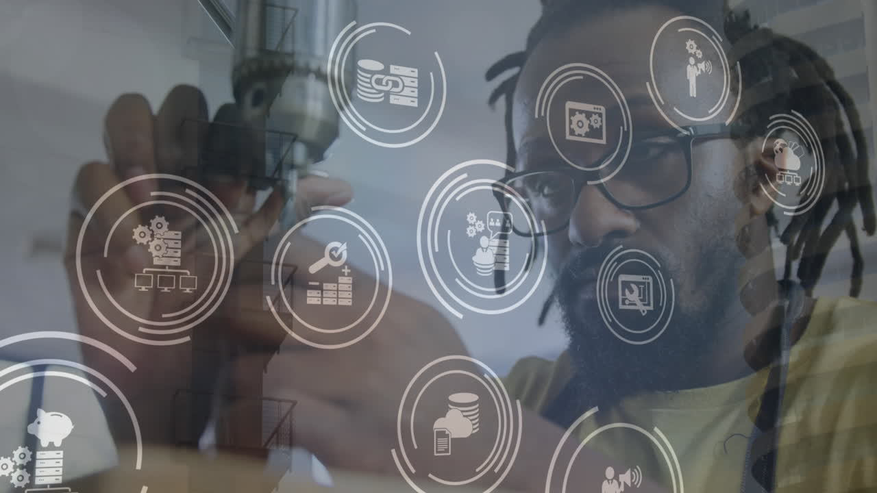 animación de iconos digitales sobre carpintero afroamericano usando una máquina de perforación en el taller.
