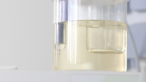 laboratory glassware with solution and probe