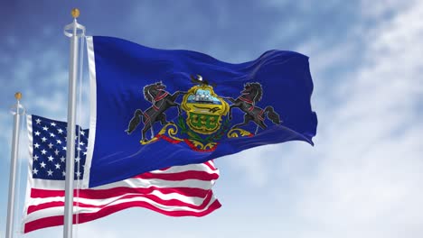 the pennsylvania state flag waving along with the national flag of the united states of america