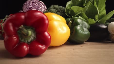 Zoom-out-macro-video-of-rolling-colorful-peppers