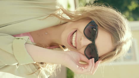 smiling woman in a light beige jacket