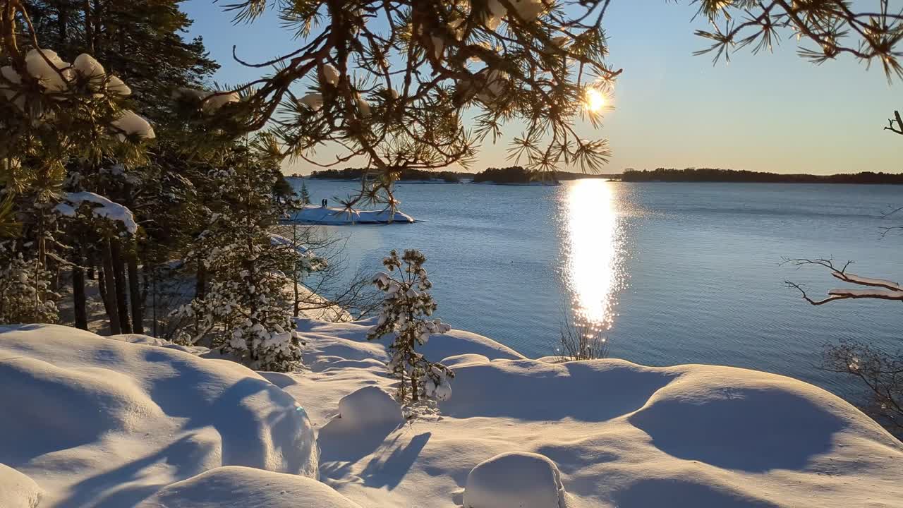 Sunset nature sea view in winter with snow, peaceful winter moment