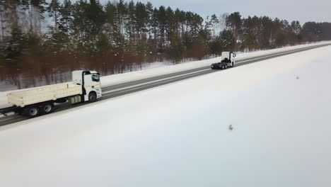 trucks on a snowy highway