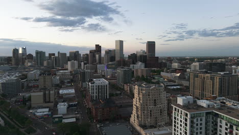 aerial view rising in front of downtown denver, dramatic dusk in colorado, usa