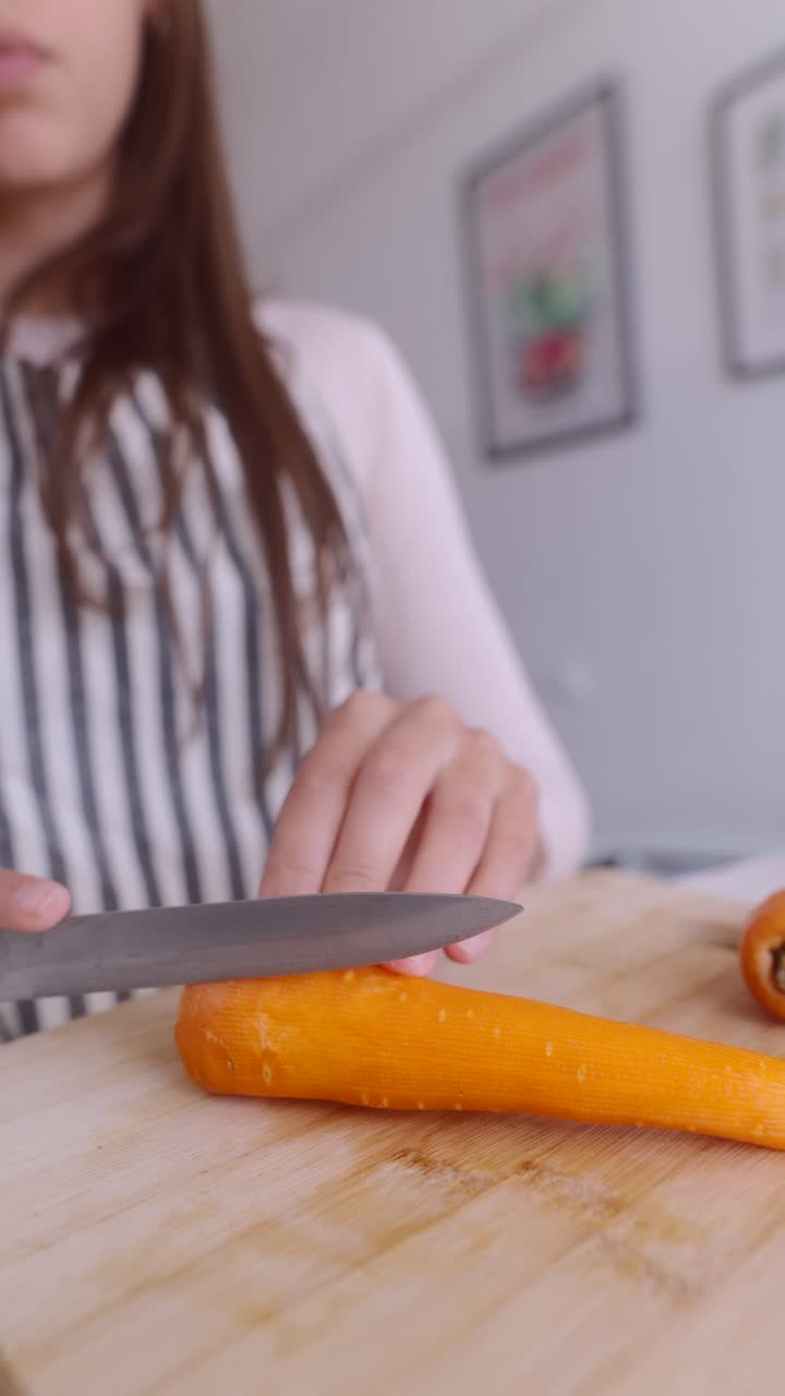 Woman Cutting a Carrot