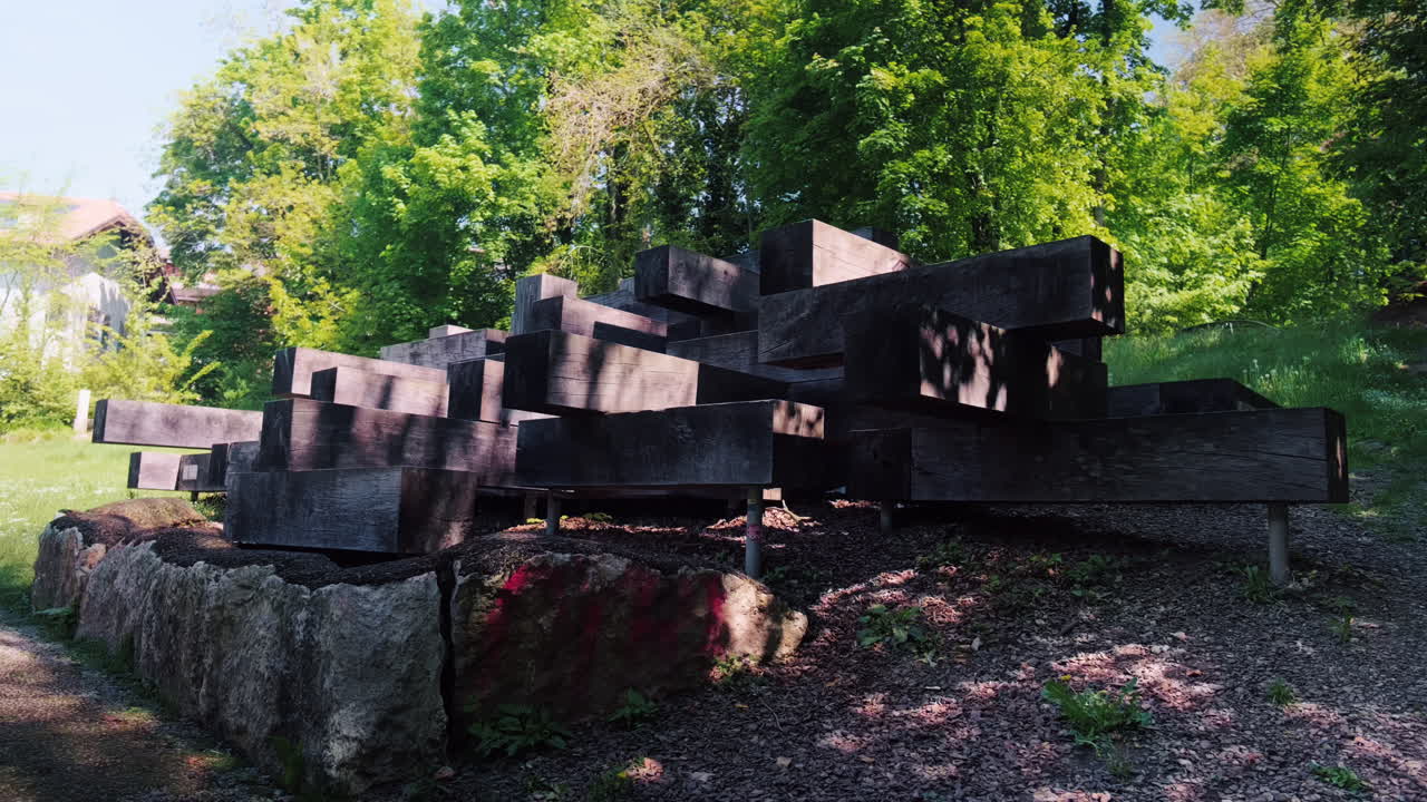Wide shot of the large wooden structure during the day in Nyon, canton of Vaud, Switzerland, static, outdoor
