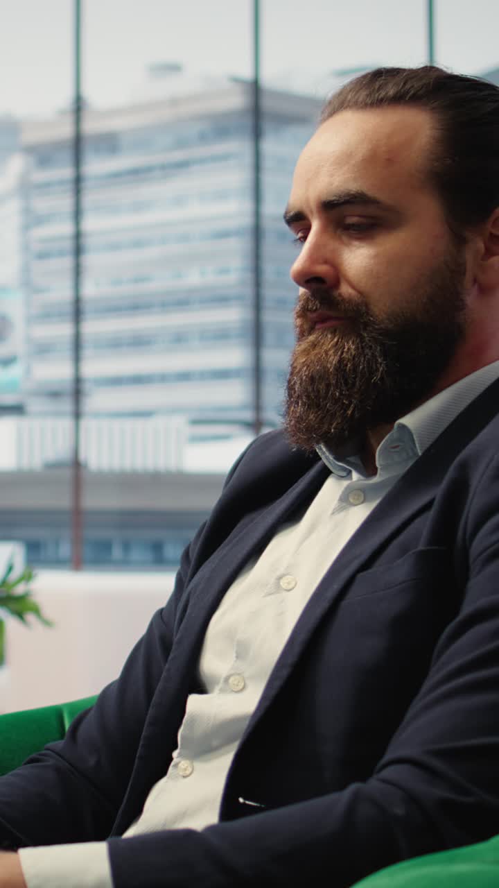 Vertical Video Determined CEO working on laptop in modern office to create an analysis