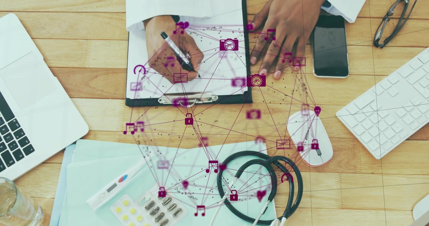 Animation of globe of digital icons against overhead view of mid section of man talking notes