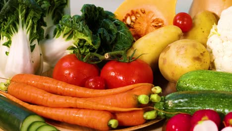 assorted vegetables arranged on a blue background