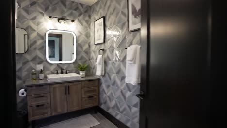 stylish modern bathroom design featuring geometric patterns, elegant fixtures, and natural light for a serene oasis experience
