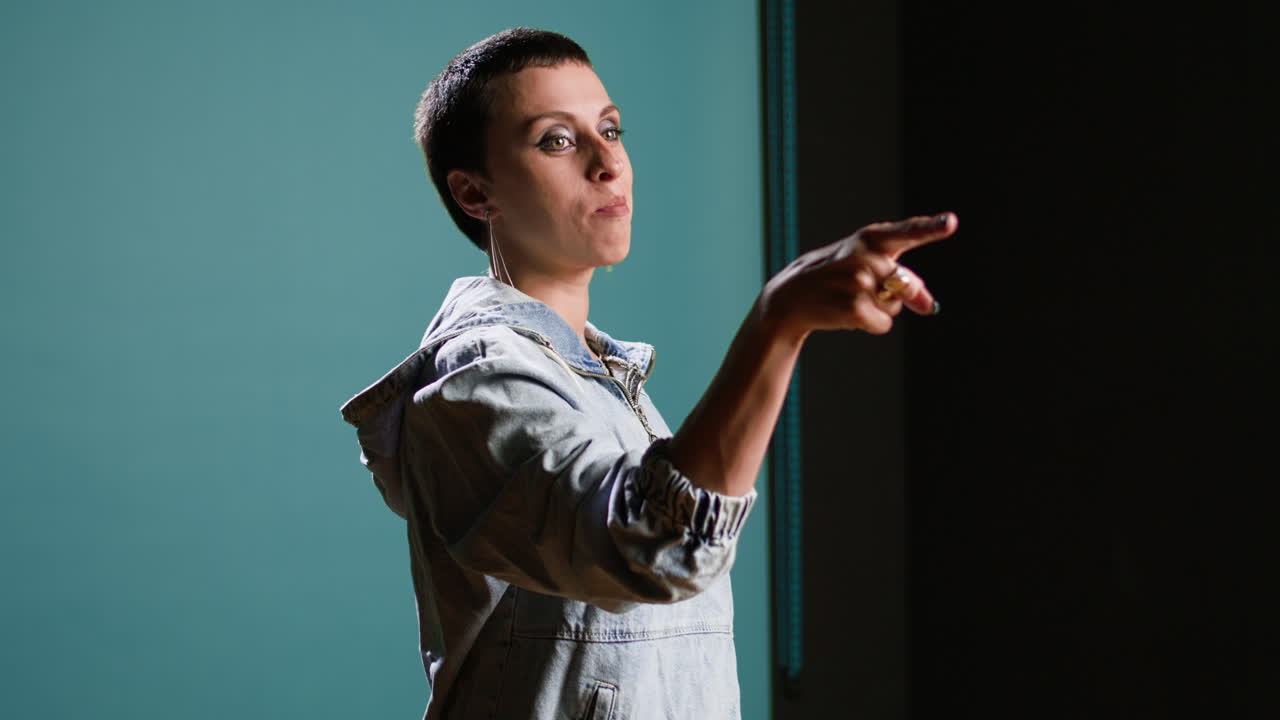 Woman with denim jacket pointing