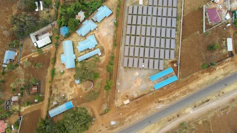 Jib-down-of-solar-panel-farm-in-rural-Africa--Sdg-green-renewal-energy--Solar-panel-cell-photovoltaic-farm