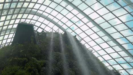 waterfall traveling inside cloud forest gardens by the bay singapore