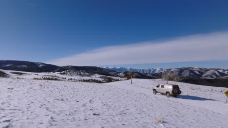 drone aerial colorado mountains van entering and exiting snow scene