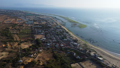 Beautiful-aerial-shot-of-coastal-city-with-sandy-beach-and-Ocean-during-sunny-day---Ninh-thuan,-phan-rang,Vietnam