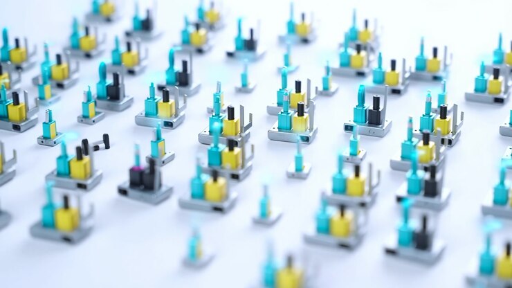 Ampia vista dal basso mostra decine di unità hardware elettroniche modulari disposte a file sfalsate su una superficie bianca opaca, con basi argentate, dettagli colorati e uno sfondo sfocato e morbido.