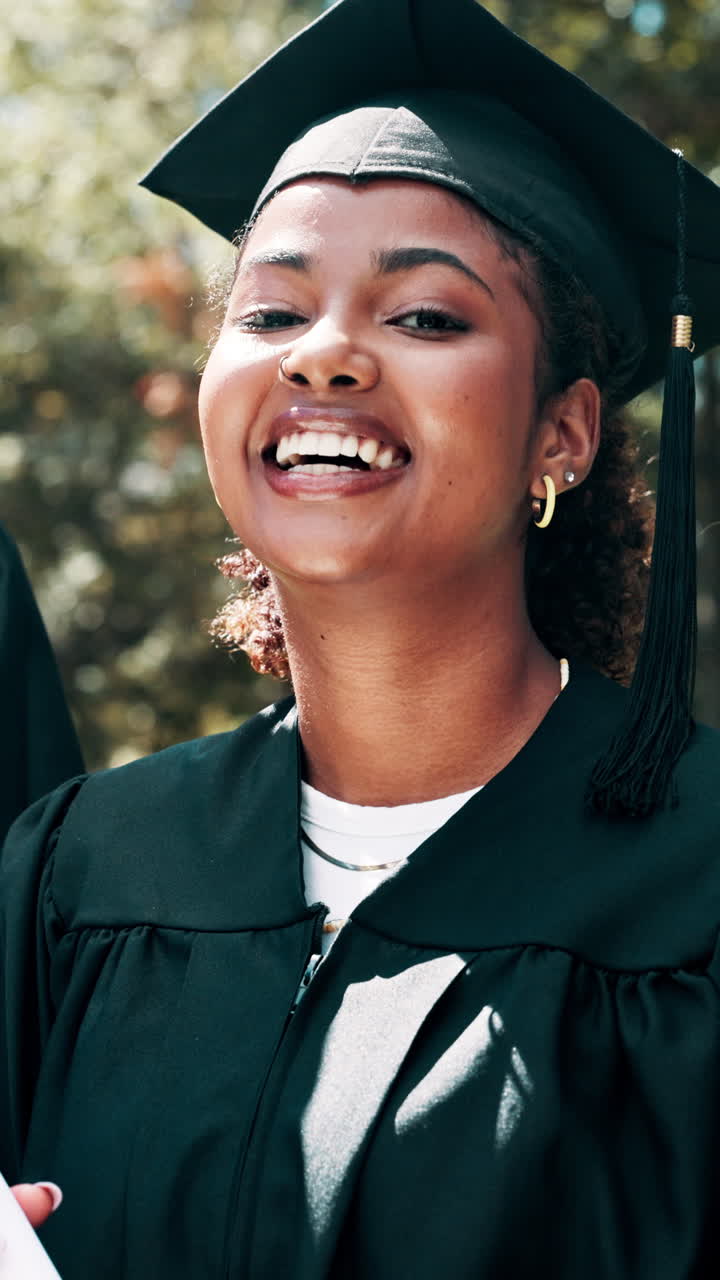 Happy Young Woman in Graduation Cap and Gown Smiling