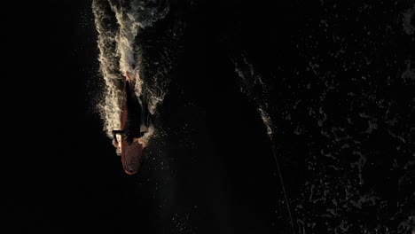 surfer surfing longboard with takeoff filmed from above-1