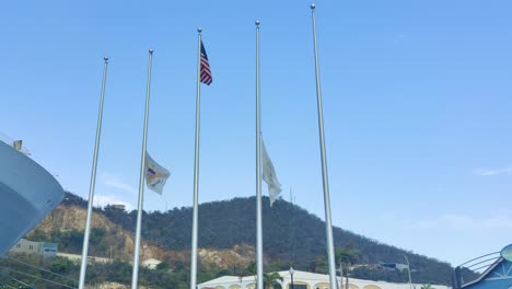 flag of st thomas virgin island and usa waving on poll on port of st thomas virgin island | st thomas flag waving on half mast to honoring victims of tragedy video background in 4k-1