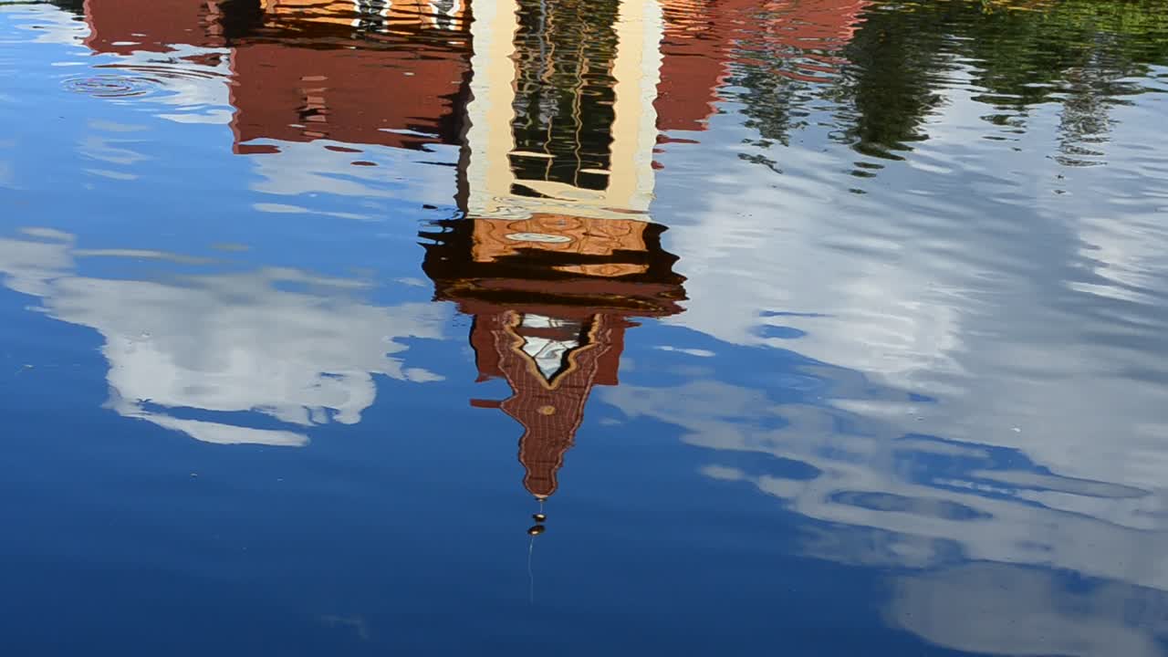 Reflection of the building in water. Reflection shooting