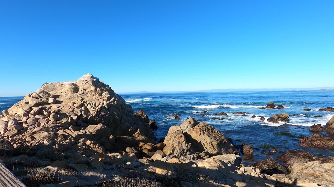 A beautiful winter day at Carmel by the Sea, California, Ocean Waves Crashing over the rocks - 4K Still