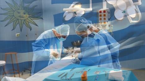 Animation-of-flag-of-uruguay-waving-over-surgeons-in-operating-theatre