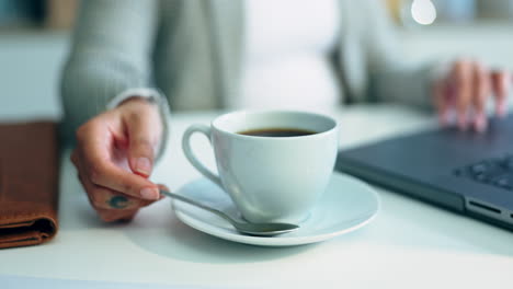 person, hand and coffee cup in cafe with laptop