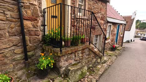 stone buildings with colorful doors and plants