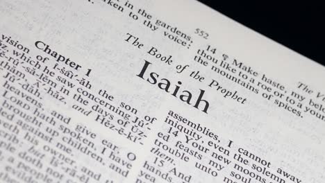 Close-Up-Bible-Page-Turning-to-the-book-of-Isaiah