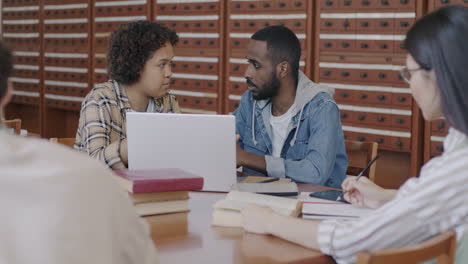 students collaborating in a library
