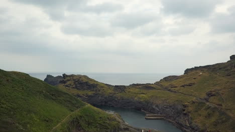 tintagel coastal harbour on cornwall coastline, aerial view