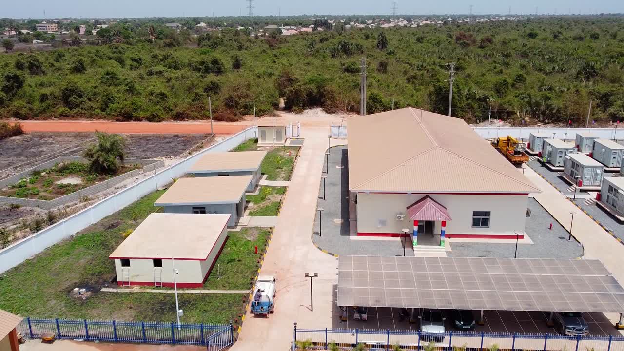 Aerial dolly overview of completed pv power plant with BESS, The Gambia