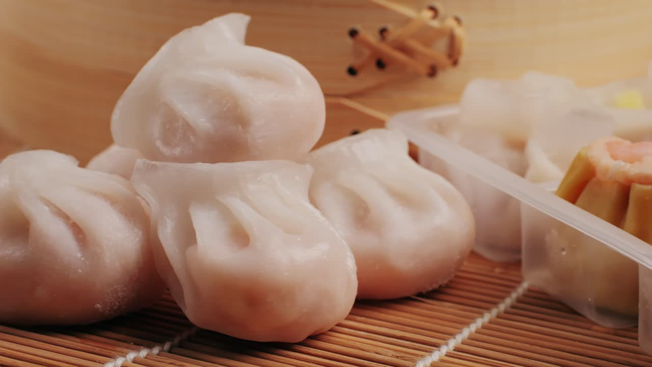 Various of frozen dim sum close-up macro. Food to take away. Chinese dessert food. Dimsum with shrimps, fish and meat. Dish in a cafe. Delivery