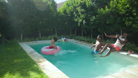 diverse friends enjoying pool party with inflatables, splashing water, and having fun
