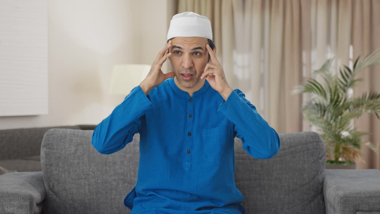 머리가 아픈 병든 무슬림 남자