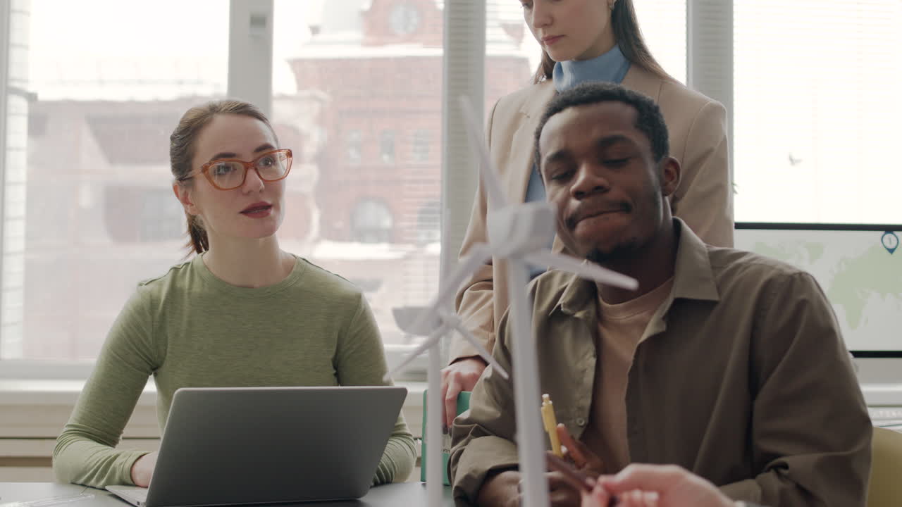 Multiethnic Business Team Discussing About Renewable Energy Project In The Office 3