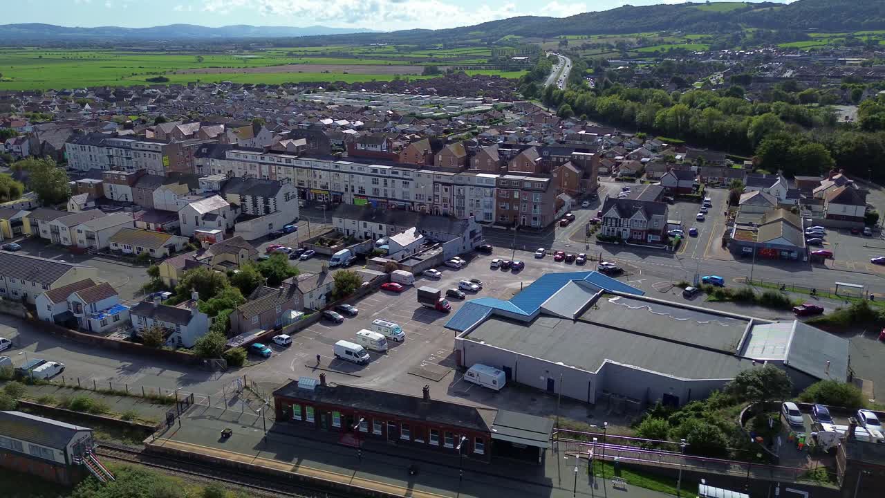 Penrhos and Abergele town aerial view over railway station and sunny Welsh townscape