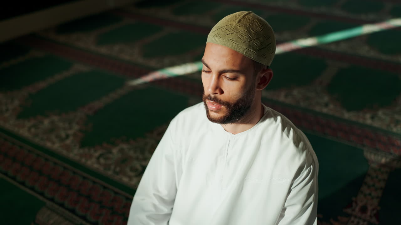 Muslim man praying in a mosque