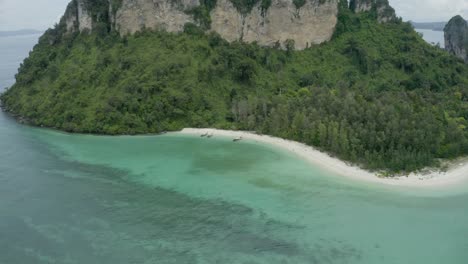 establishing shot of the beach and tropical island with beautiful water, koh phi phiisland, thailand