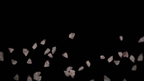 volando muchas piedras de roca en fondo negro. explosión de salpicaduras rotas. concepto de desafío. animación 3d de salpicadas de piedra girando. animación de bucle.