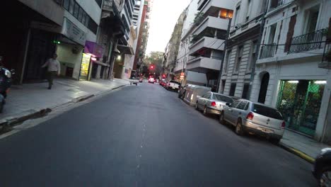 driving at european style neighborhood pov of buenos aires city