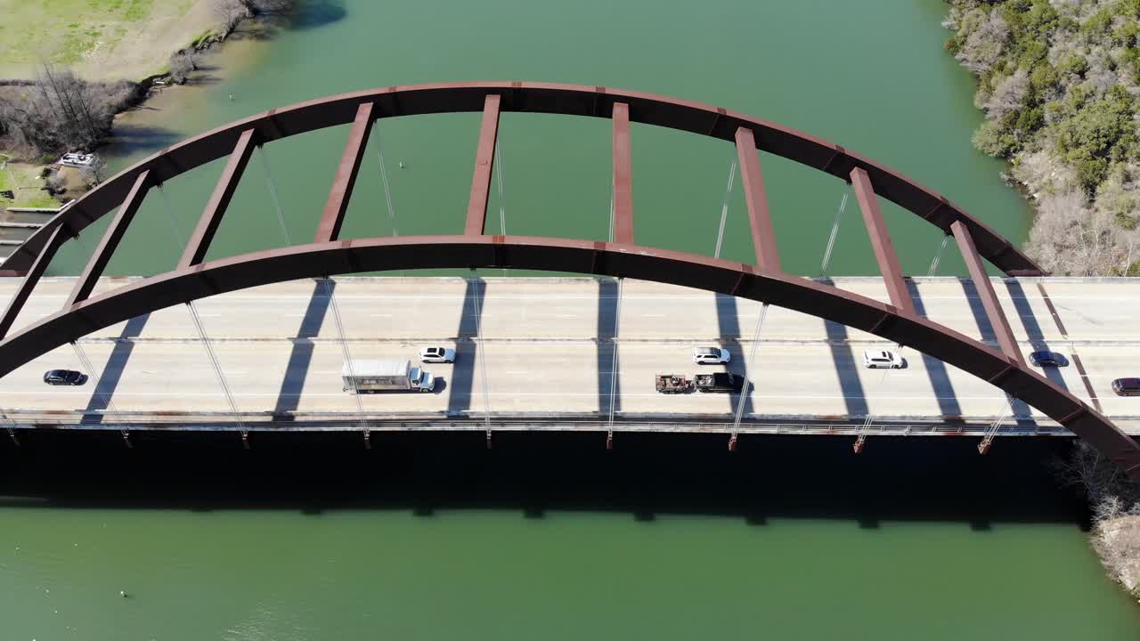 Aerial Austin Pennybacker Bridge - diagonal viewpoint of the bridge from above, moving towards the right very slowly. Panning to the left so that bridge is at an angle.