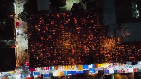 Aerial-view-above-a-illuminated-cemetery,-during-day-of-the-Dead,-in-Mexico---overhead,-drone-shot