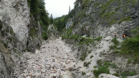 hiking trail two people walking along trail almach gorge bavarian alps germany