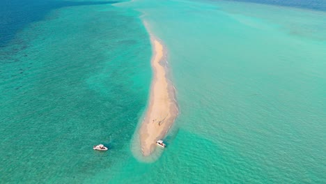 an awe-inspiring aerial drone view captures the rasdhoo sandbanks glowing under the soft, golden light of sunset in the maldives.