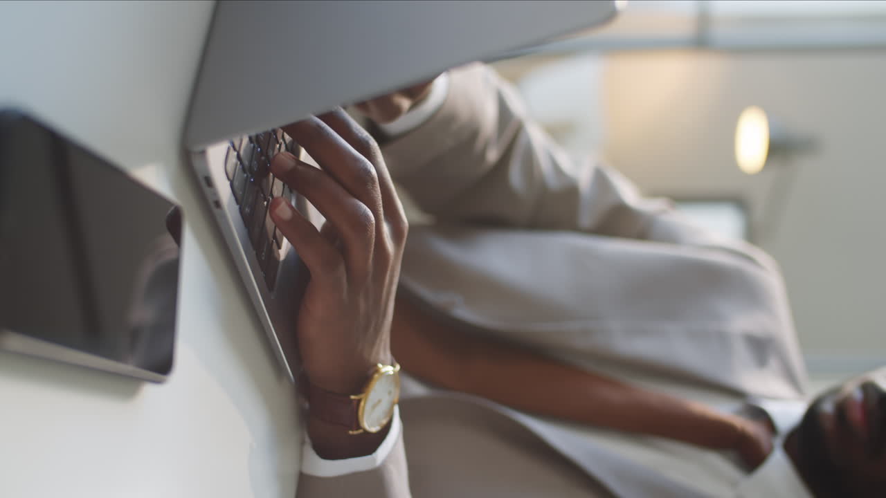 Close Up of African American Businessman Typing on Laptop