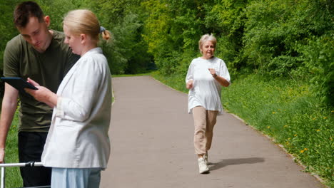 elderly woman running with support in park