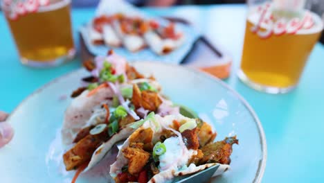 delicious tacos and beer on a table