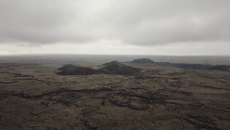 barren lava fields formed by eruption of magma from beneath earth’s surface