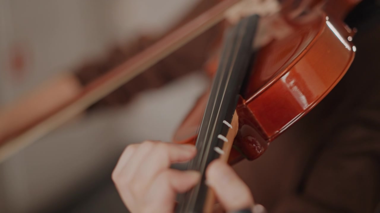 Violin technique showcase. Closeup of violinist demonstrating accurate finger placement techniques. Photograph highlighting detailed finger movements and accurate intonation in violin performance